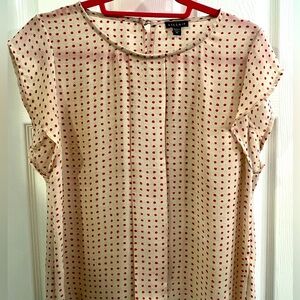 Light beige feminine top with red polka dots